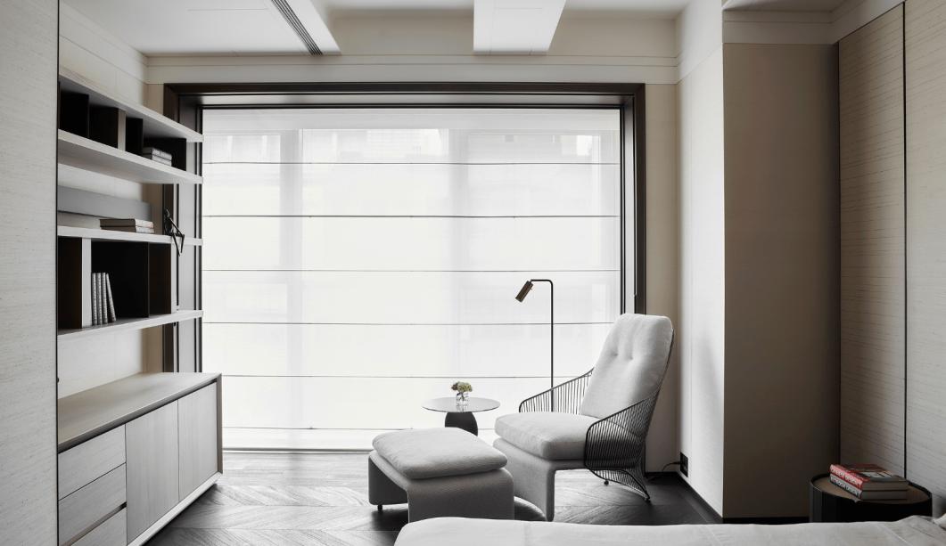 Sheer Roman blinds across a full-width window in a quiet study