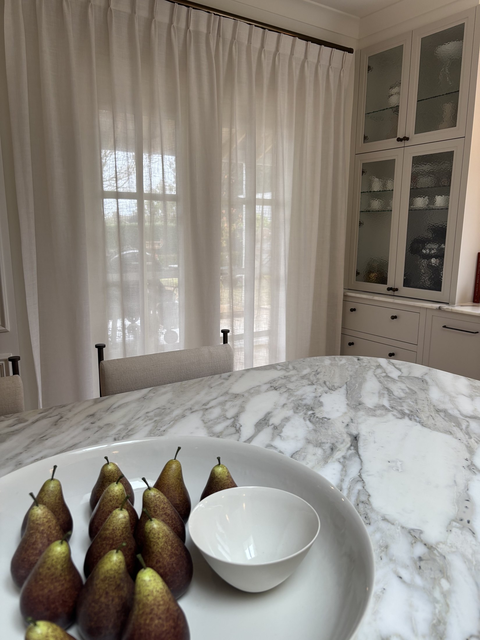 Emu Plains kitchen and living area with knife pleat sheers on a bronze track
