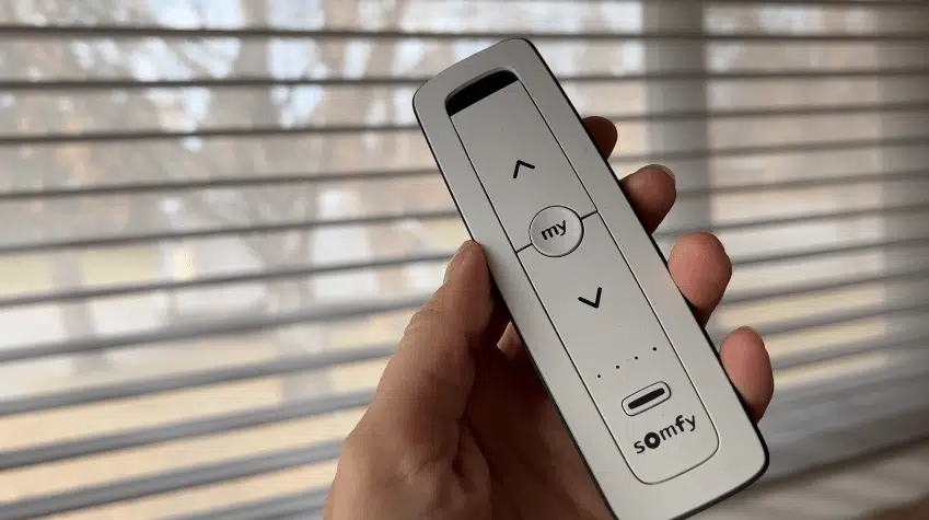 Hand-held Somfy remote controlling motorised window blinds